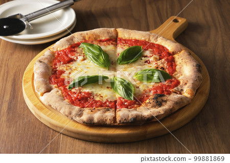Delicious wood-fired pizza margherita 99881869