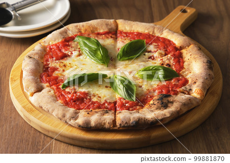Delicious wood-fired pizza margherita 99881870