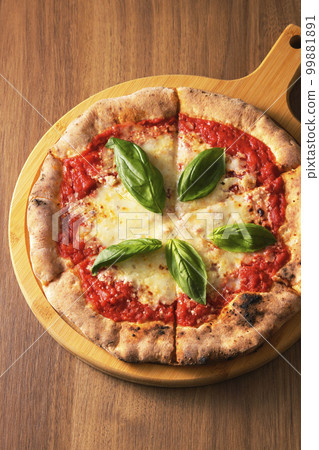 Delicious wood-fired pizza margherita 99881891