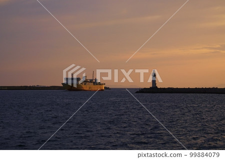 Ferry and lighthouse arriving at the port in the evening Spring/Air mainly/220505pm Ferry and lighthouse arriving at the port in the evening Spring/Air mainly/220505pm 99884079