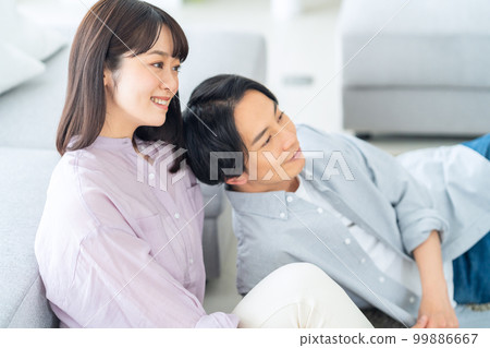 Married couple, family, lifestyle, living room Married couple, family, lifestyle, living room 99886667