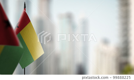 Small flags of the Guinea Bissau on an abstract blurry background 99888225