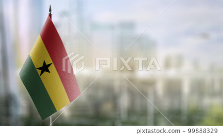 Small flags of the Ghana on an abstract blurry background 99888329