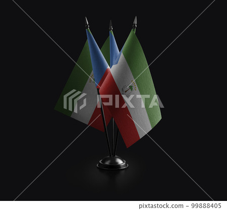 Small national flags of the Equatorial Guinea on a black background 99888405
