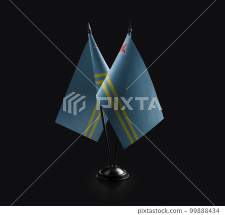 Small national flags of the Aruba on a black background 99888434
