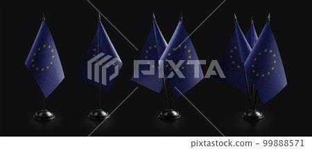 Small national flags of the European Union on a black background 99888571