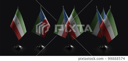 Small national flags of the Equatorial Guinea on a black background 99888574