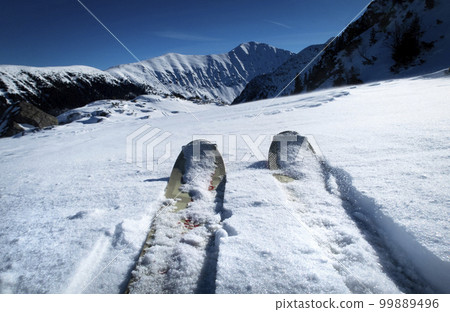 view of skialp skis in the background of snowy mountains view of skialp skis in the background of snowy mountains 99889496