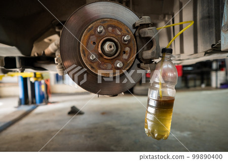 Automatic change of brake fluid in a car service. Automatic change of brake fluid in a car service. 99890400