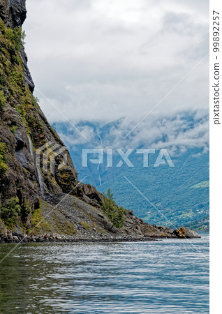 Beautiful view of Flam Fjord from a cruise boat trip Beautiful view of Flam Fjord from a cruise boat trip 99892257