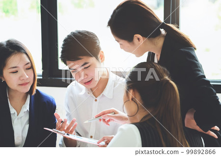 Start-up Business, a team of young entrepreneurs working together to increase profits into the company to increase business potential. 99892866