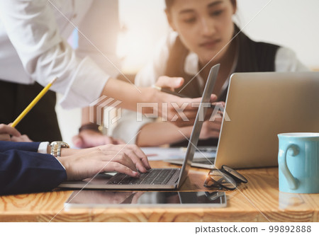 Start-up Business, a team of young entrepreneurs working together to increase profits into the company to increase business potential. 99892888