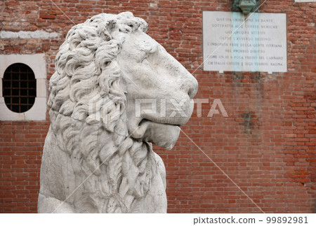 The head of a marble lion at the main entrance to the Venetian Arsenal. Italy 99892981