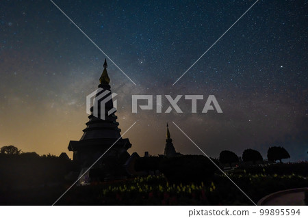 Night sky time lapse of moving Milky Way and stars under moon light at Phra Mahathat monuments on Doi Inthanon Night sky time lapse of moving Milky Way and stars under moon light at Phra Mahathat monuments on Doi Inthanon 99895594