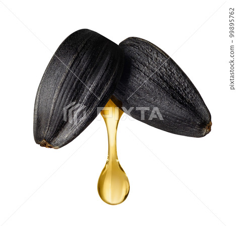 sunflower oil drop falling from flying seeds isolated on white sunflower oil drop falling from flying seeds isolated on white 99895762