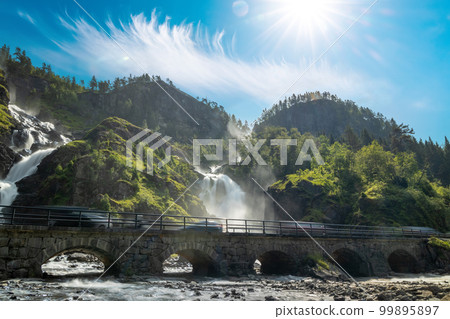 Latefossen is one of the most visited waterfalls in Norway and is located near Skare and Odda in the region Hordaland, Norway. Consists of two separate streams flowing down from the lake Lotevatnet. Latefossen is one of the most visited waterfalls in Norway and is located near Skare and Odda in the region Hordaland, Norway. Consists of two separate streams flowing down from the lake Lotevatnet. 99895897