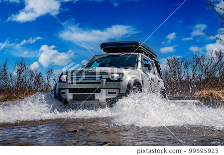 Off road tourist car rides off-road in the highlands. Expedition travel and vacation, adventures in remote areas. 99895925