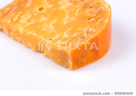 Piece of old hard cheese 99896409