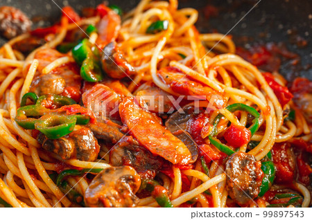 Napolitan with tomato sauce in a frying pan 99897543