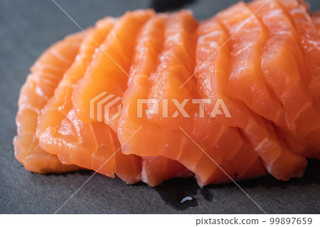 Sliced salmon fillet. Eat raw. sashimi. Sliced salmon fillet. Eat raw. sashimi. 99897659