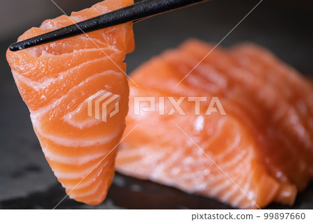 Sliced salmon fillet. Eat raw. sashimi. 99897660