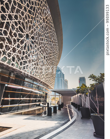 Dubai Opera house in Downtown Dubai, surrounded by skyscrapers and Burj Khalifa, in UAE, United Arab 99899133