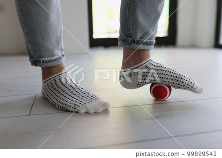 Myofascial relaxation of foot muscles with ball at home. 99899541