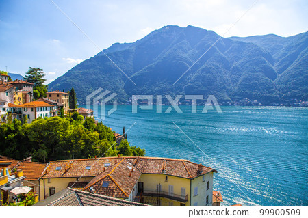 Aerial view of Nesso, a picturesque and colourful village sitting on the banks of Lake Como, Italy Aerial view of Nesso, a picturesque and colourful village sitting on the banks of Lake Como, Italy 99900509