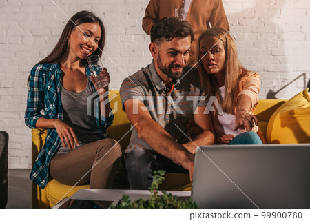 Business people that work together in office with a laptop Business people that work together in office with a laptop 99900780