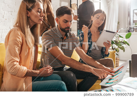 People work together in a modern office as teamwork and partner 99900789