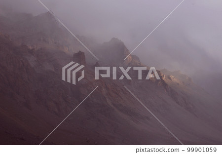 Snow storm in the mountains haze wind snow falling. Parque provincial Aconcagua, Mendoza Argentina 99901059