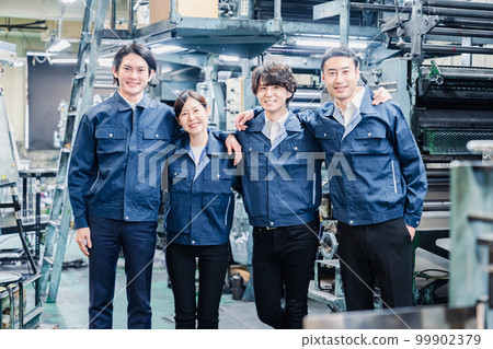 Factory staff working hand-in-hand Factory staff working hand-in-hand 99902379