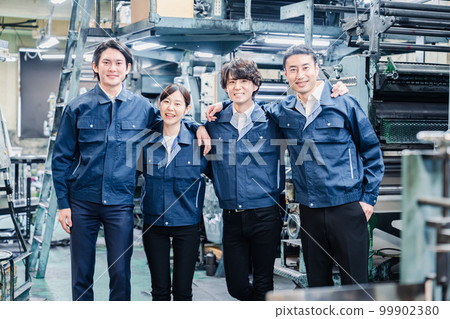 Factory staff working hand-in-hand Factory staff working hand-in-hand 99902380