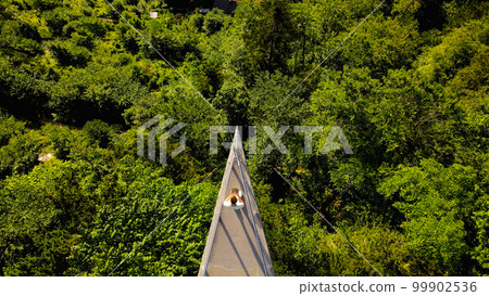 A man stay in Skywalk platform of Hallstatt, Hallstatter See of Austria 99902536