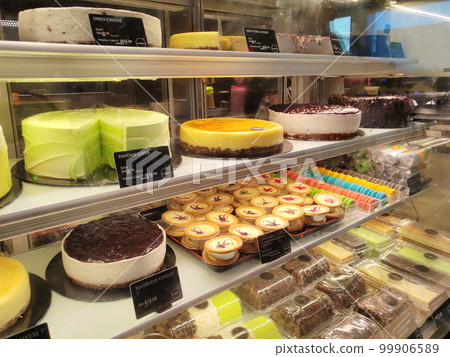MELAKA, MALAYSIA - MARCH 4, 2022: Various types of cakes with various flavors are on display in the chiller display. Price tags are provided to make it easier for customers to buy. 99906589