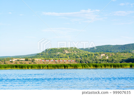 Train on the railway on the bank of the river Sok in the village of Malaya Tsarevschina Samara region Russia 99907635