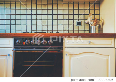 Vintage retro kitchen with green pattern tiles, american retro kitchen home interior design 70's 80's style close-up. retro Vintage retro kitchen with green pattern tiles, american retro kitchen home interior design 70's 80's style close-up. retro 99908206
