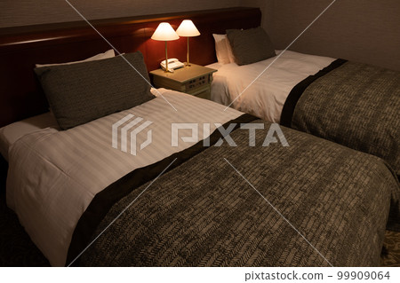 hotel bed at night 99909064