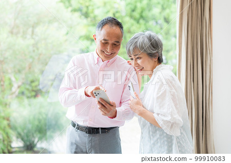 Senior couple with smartphone Senior couple with smartphone 99910083