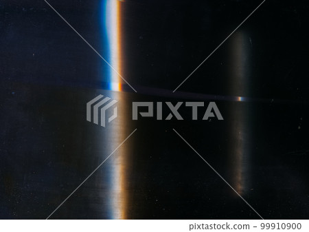 Distressed noise. Retro film overlay. Aged filter. Blue orange color light flare dirt dust scratches on dark black worn abstract illustration background. 99910900