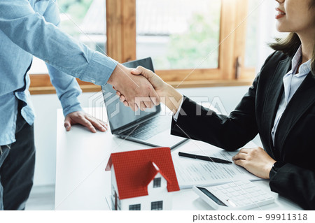 Laws, contracts, mortgages, clients join hands with real estate agents congratulating real estate agents on home and land purchase agreements with insurance to reduce risks during home installments. Laws, contracts, mortgages, clients join hands with real estate agents congratulating real estate agents on home and land purchase agreements with insurance to reduce risks during home installments. 99911318