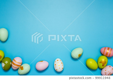 Easter Eggs. Colorful Easter eggs on blue background with copy space Easter Eggs. Colorful Easter eggs on blue background with copy space 99911948