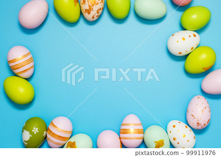 Easter Eggs. Colorful Easter eggs on blue background with copy space Easter Eggs. Colorful Easter eggs on blue background with copy space 99911976