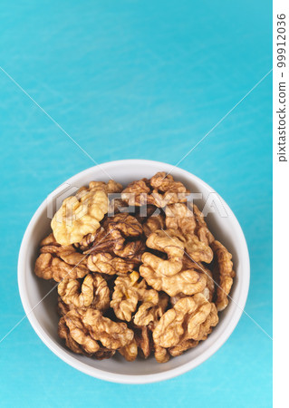 Organic walnuts in a bowl, selective focus. Organic walnuts in a bowl, selective focus. 99912036