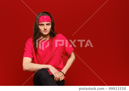 Studio portrait of confident young man with head band 99913338