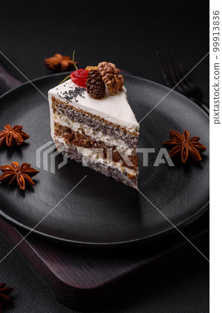 Delicious beautiful piece of cake with cream and berries 99913836