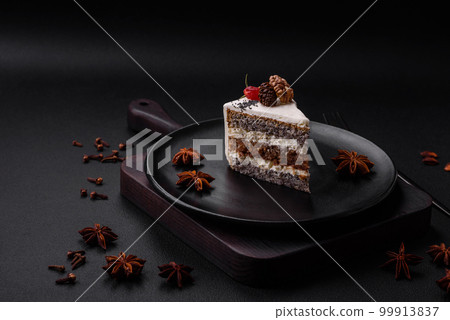 Delicious beautiful piece of cake with cream and berries 99913837