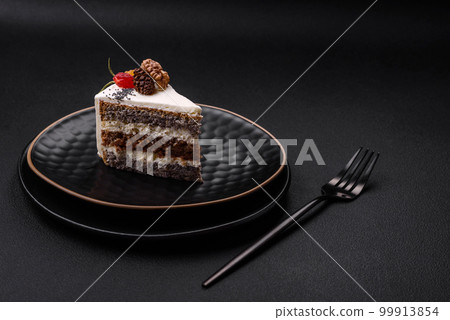 Delicious beautiful piece of cake with cream and berries 99913854