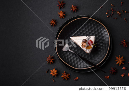 Delicious beautiful piece of cake with cream and berries 99913858