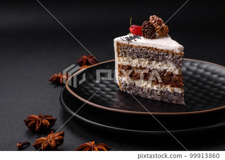 Delicious beautiful piece of cake with cream and berries Delicious beautiful piece of cake with cream and berries 99913860